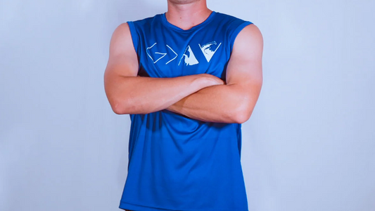 A person is wearing a blue-coloredFaithletics tank top.
